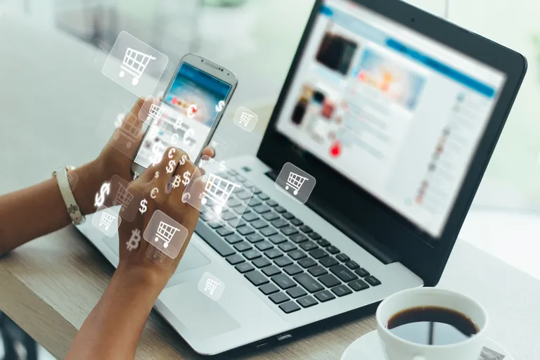 Businesswoman,Phone,And,Laptop,Using,,,Online,Shopping,Concept.
